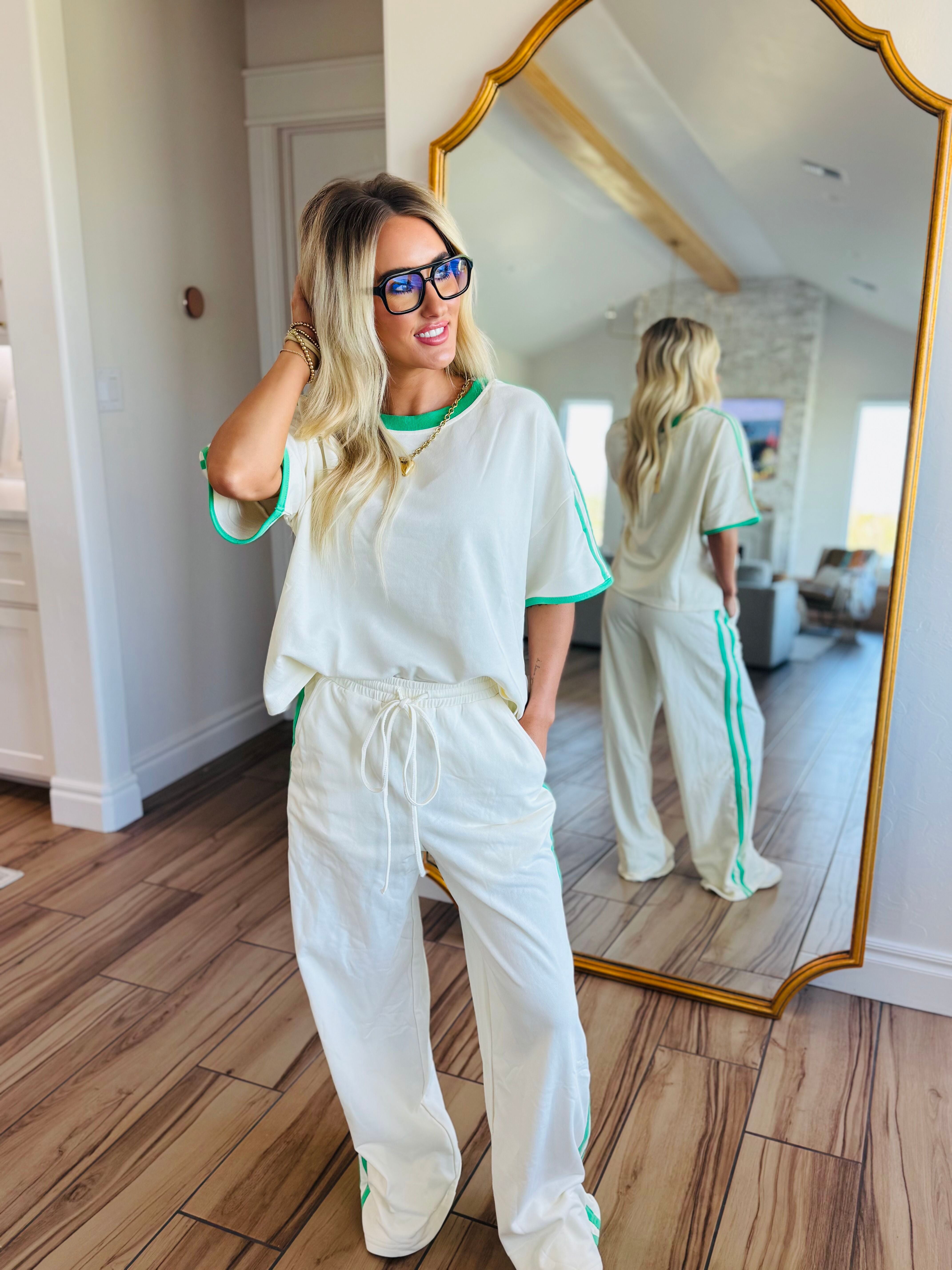 ENTRO CREAM PANT SET featuring a stylish lime green stripe design and comfy drawstring, elastic waist pants. Perfect for casual outings or relaxing at home.