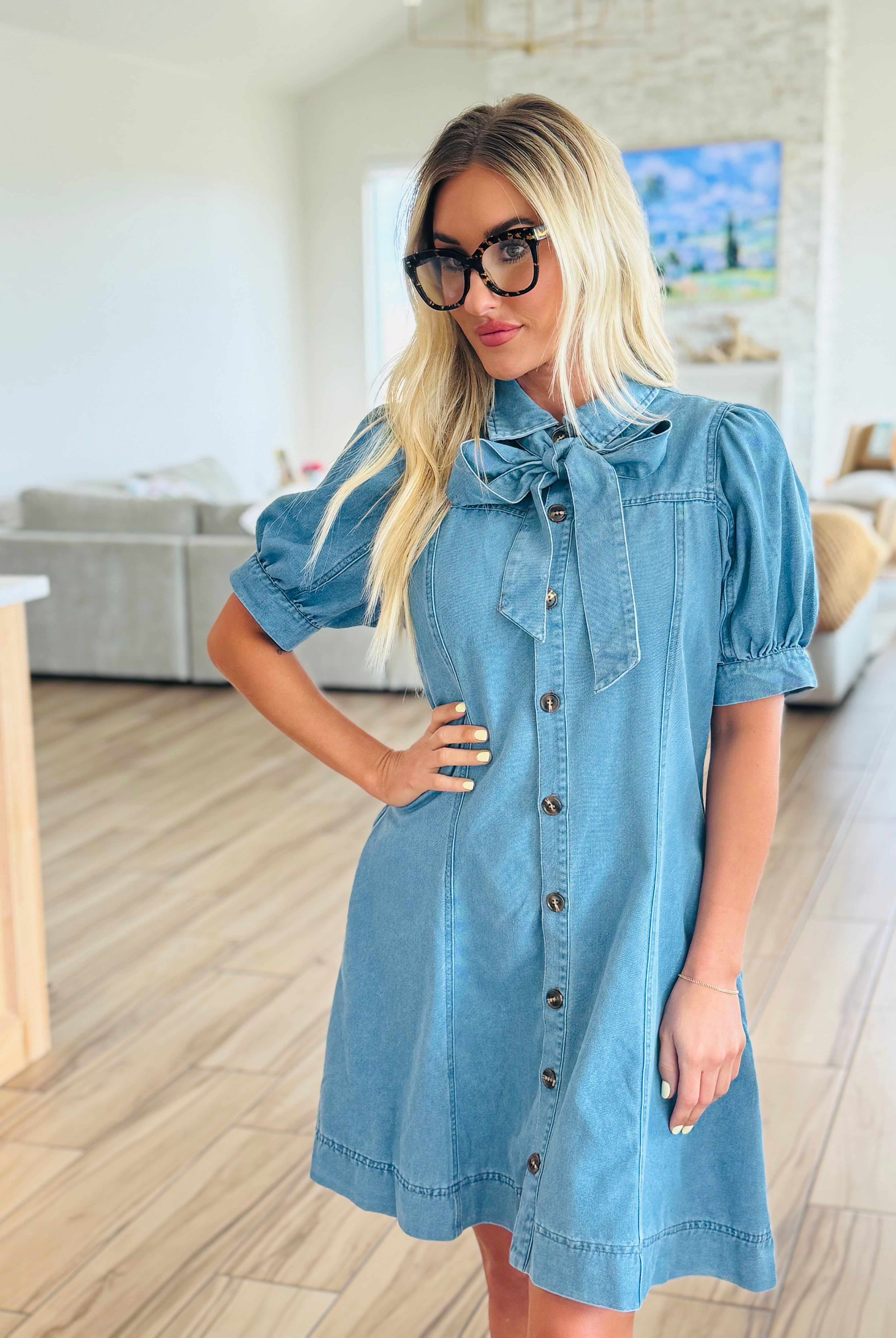 ENTRO Denim Dress with Bow Tie Neck showcasing a stylish button-down design suitable for any occasion.