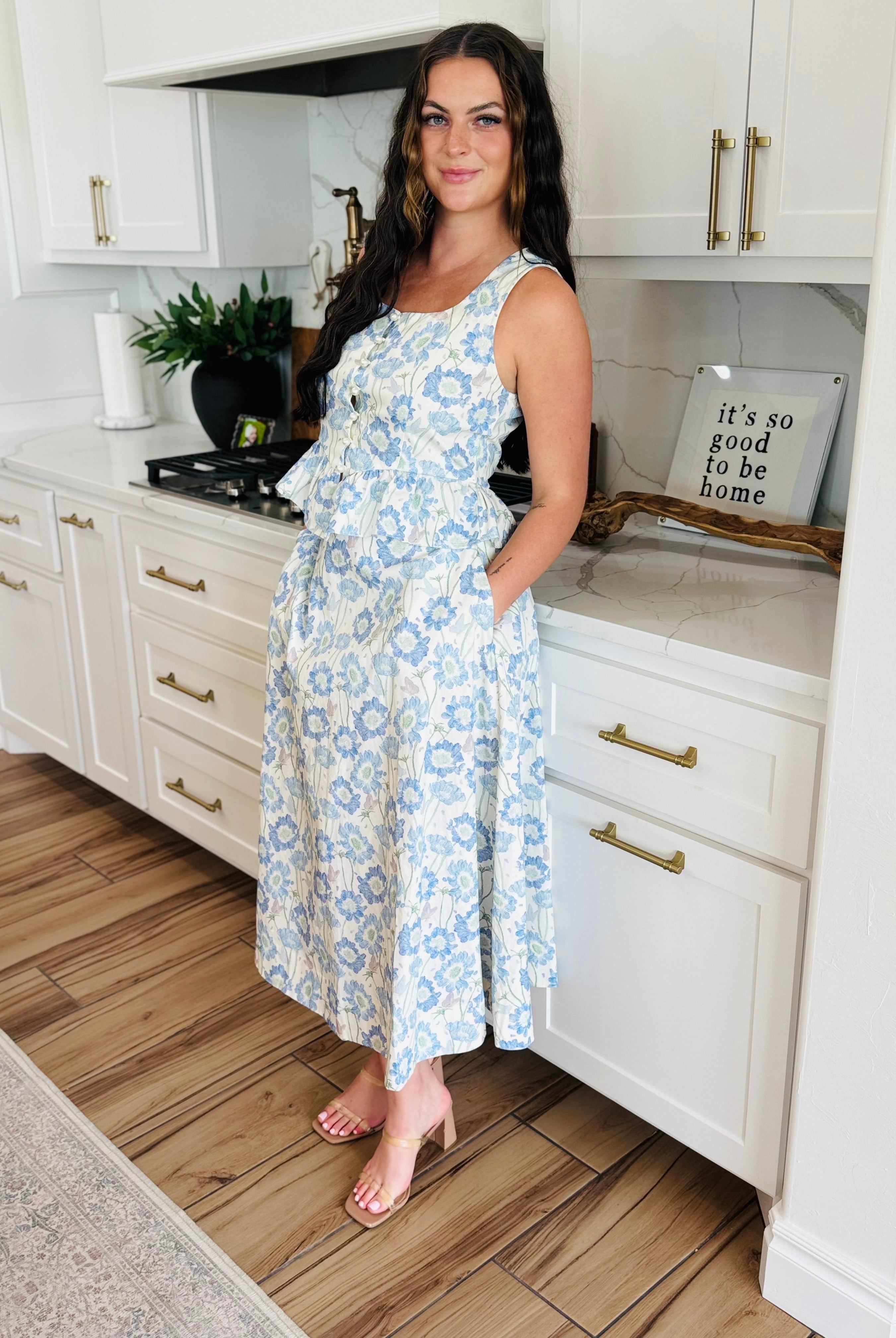 ENTRO Sleeveless Southern Belle Top with Pearls showcasing a floral design and faux pearl button details, ideal for warm weather and versatile styling.