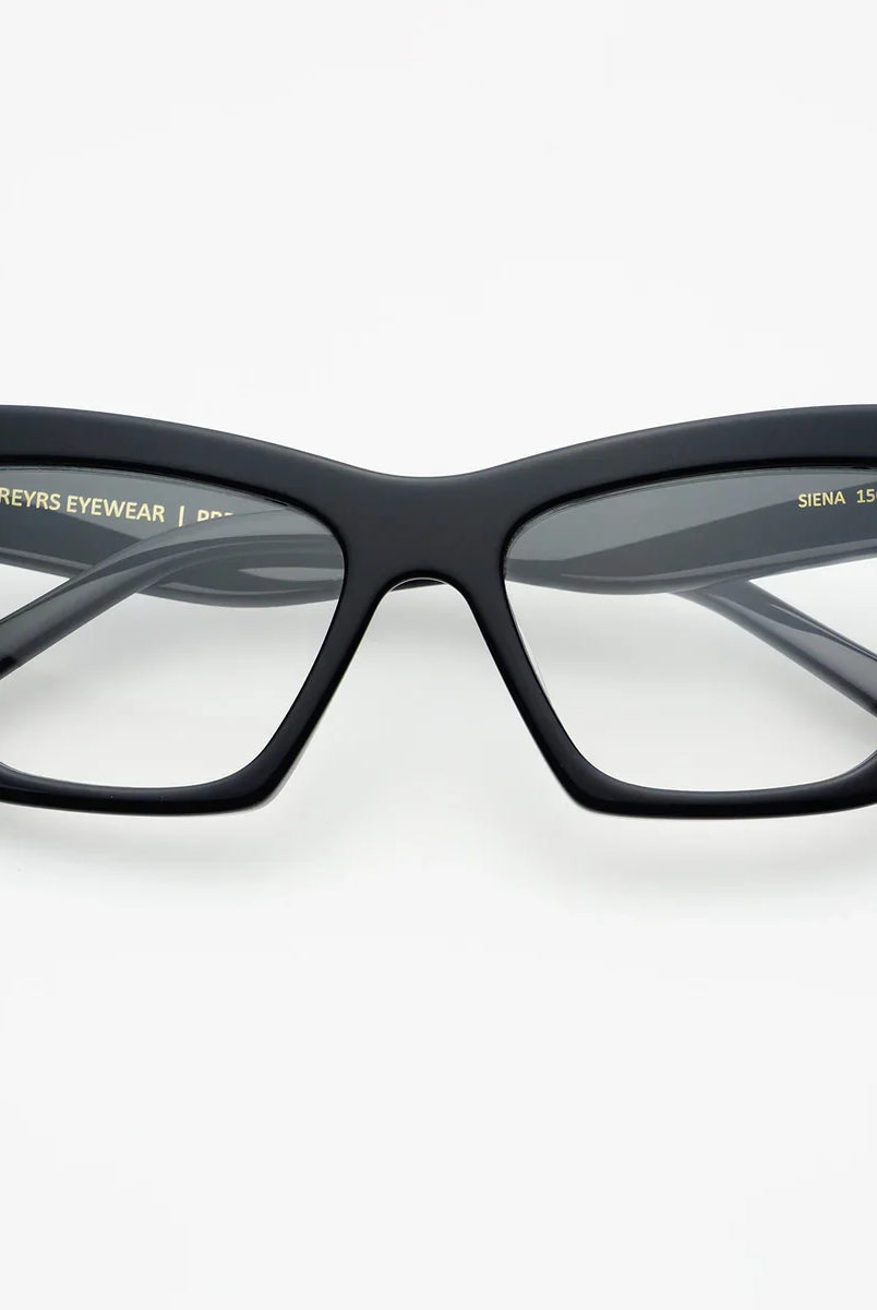 FREYRS SIENA BLUE LIGHT GLASSES in black featuring retro-chic cat-eye frames, designed for eye protection against harmful blue light, perfect for digital screen use.