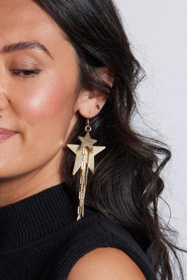 Close-up view of the GOLD SATIN ZEPPELIN EARRINGS BY NICKEL & SUEDE featuring 14k gold-filled components and a stylish design, perfect for any elegant occasion.