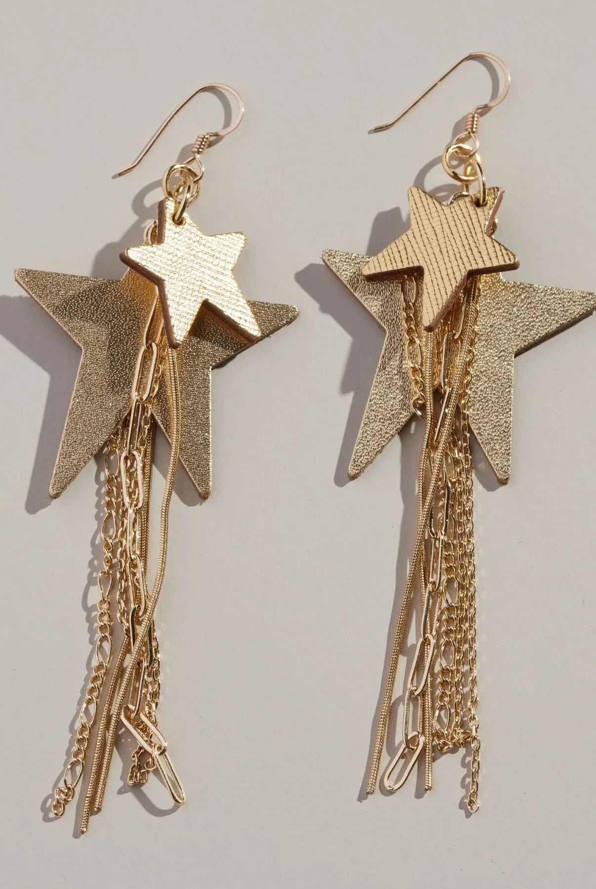 GOLD SATIN ZEPPELIN EARRINGS BY NICKEL & SUEDE showcasing a unique silhouette made from premium Italian leathers, ideal for making a bold fashion statement.