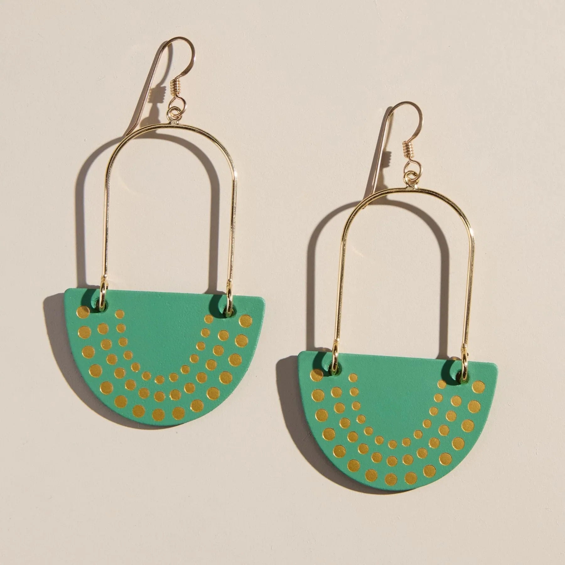 Stylish Ivy League Soho Islas Earrings by Nickel & Suede featuring smooth luxury leather and gold foil embossing for a modern touch.
