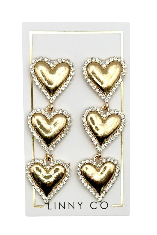Close-up view of Layla - Gold Heart Earrings, highlighting the gold plated alloy finish and heart-shaped drop.