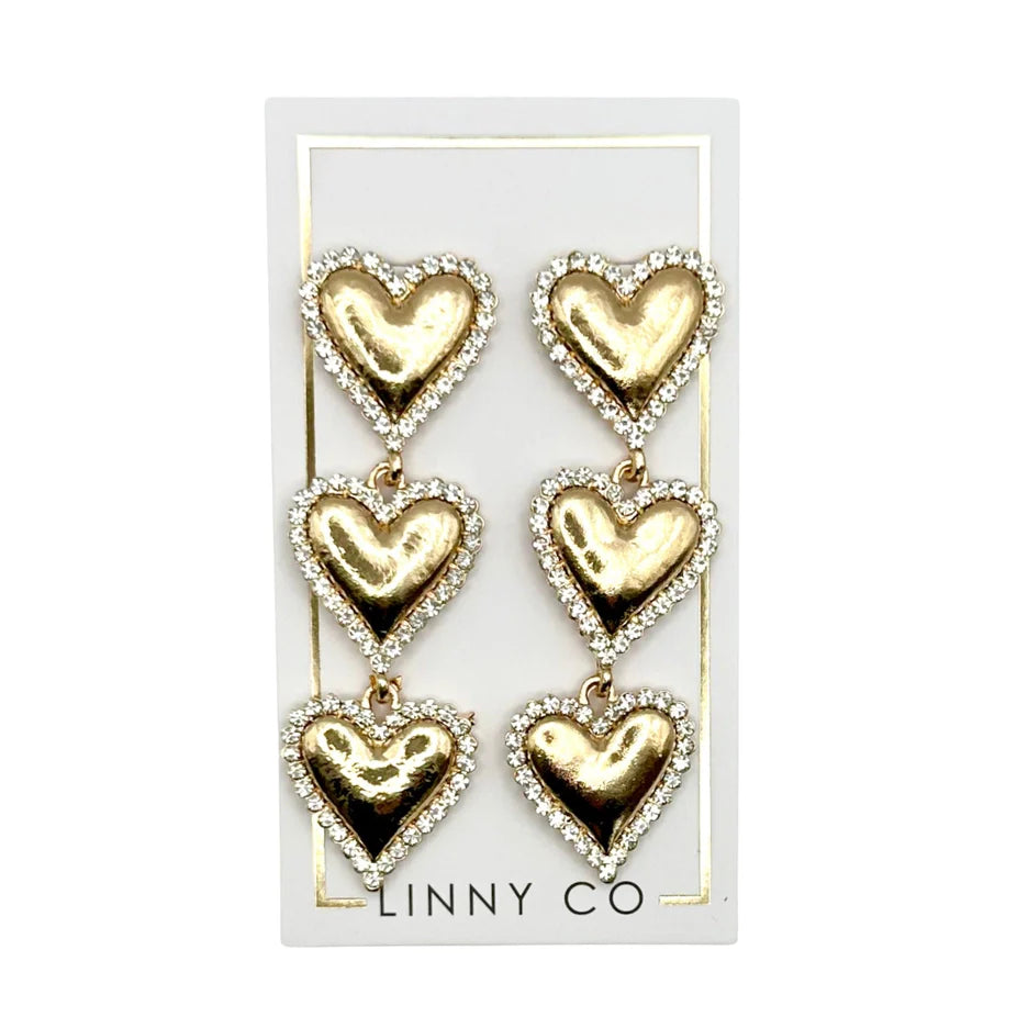 Close-up view of Layla - Gold Heart Earrings, highlighting the gold plated alloy finish and heart-shaped drop.