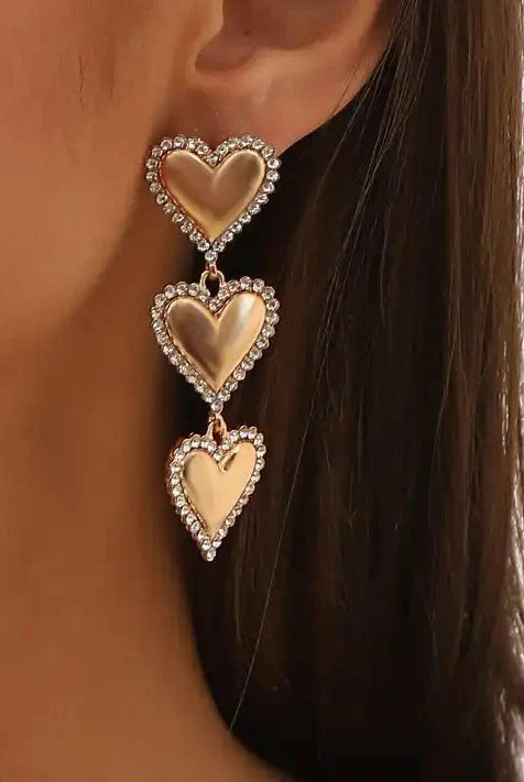 Layla - Gold Heart Earrings styled on a model, demonstrating their lightweight feel and elegant look for sensitive ears.