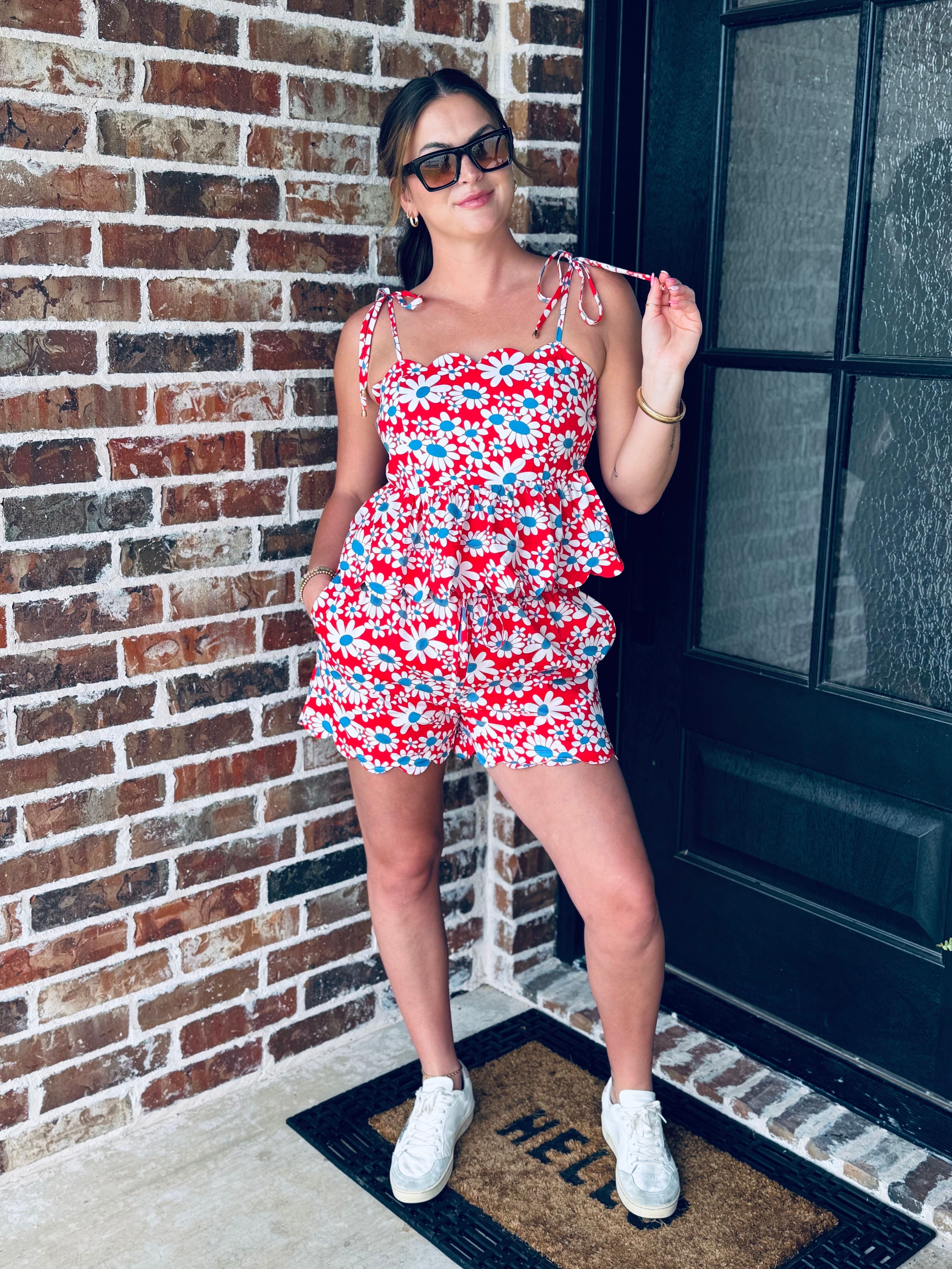 Stylish model wearing the Red, White and Blue Floral Matching Short Set showcasing adjustable tie straps and scalloped neckline.