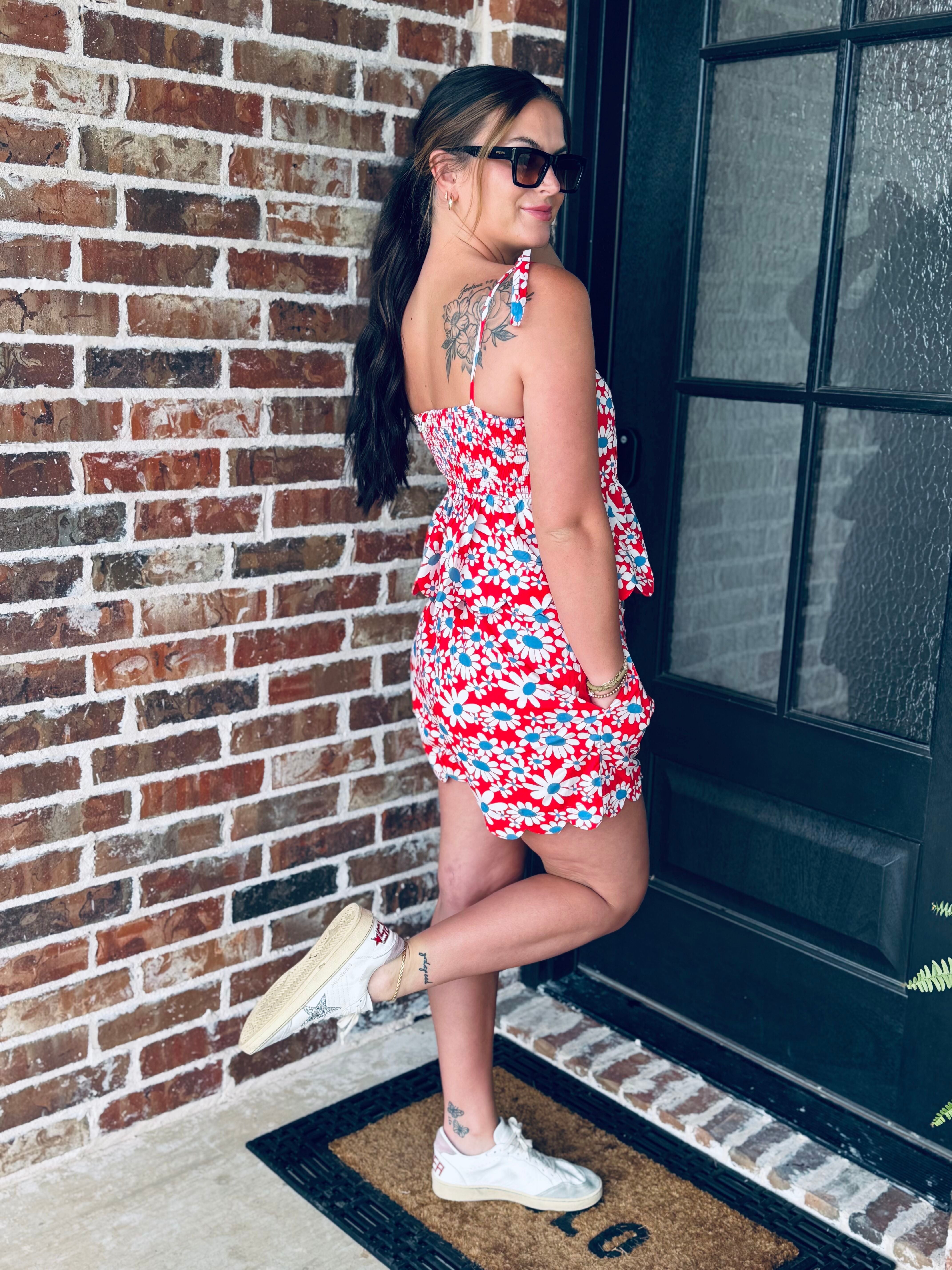 Flat lay of the Red, White and Blue Floral Matching Short Set highlighting the vibrant floral pattern and comfortable elastic waistband shorts.