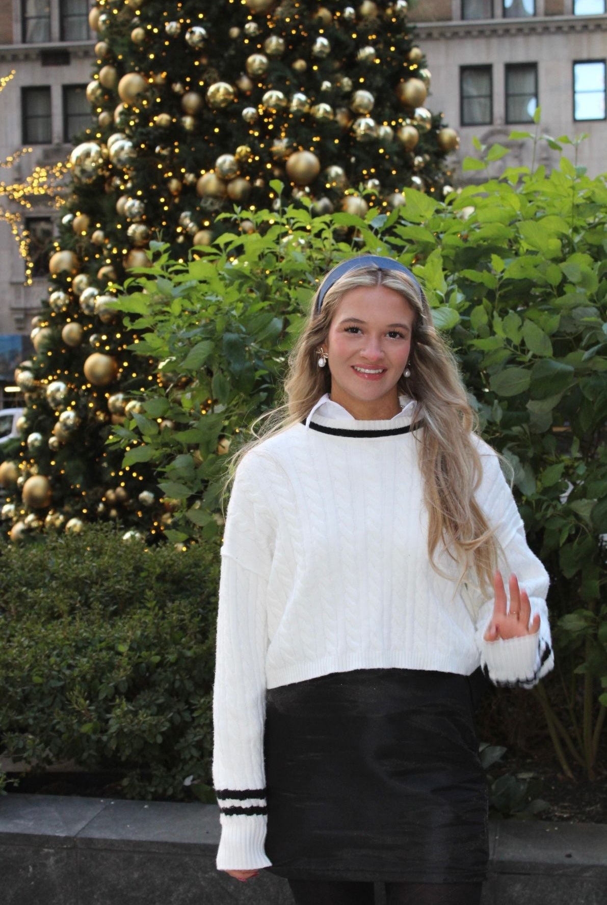 Trendy Black Bow Skirt showcasing its convenient side zip and fashionable design, perfect for elevating your wardrobe.