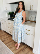 ENTRO Southern Belle Blue Floral Maxi Skirt featuring a flowy tiered design and elasticized high waistband, perfect for casual and formal occasions.