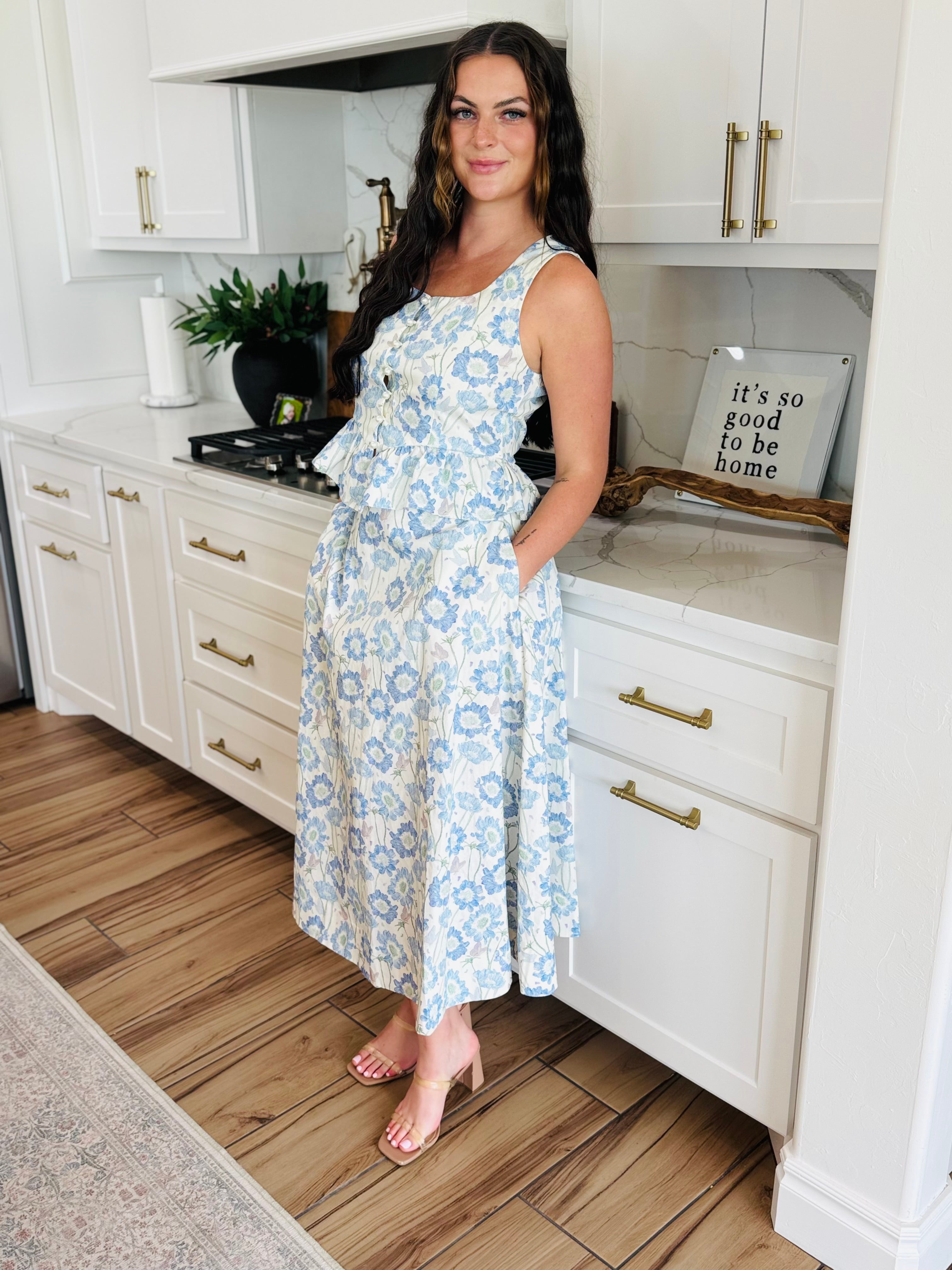 ENTRO Southern Belle Blue Floral Maxi Skirt featuring a flowy tiered design and elasticized high waistband, perfect for casual and formal occasions.