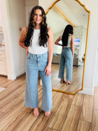 Model wearing Bluebell Scallop Denim Jeans – Light Wash by ENTRO, highlighting its comfort and style.
