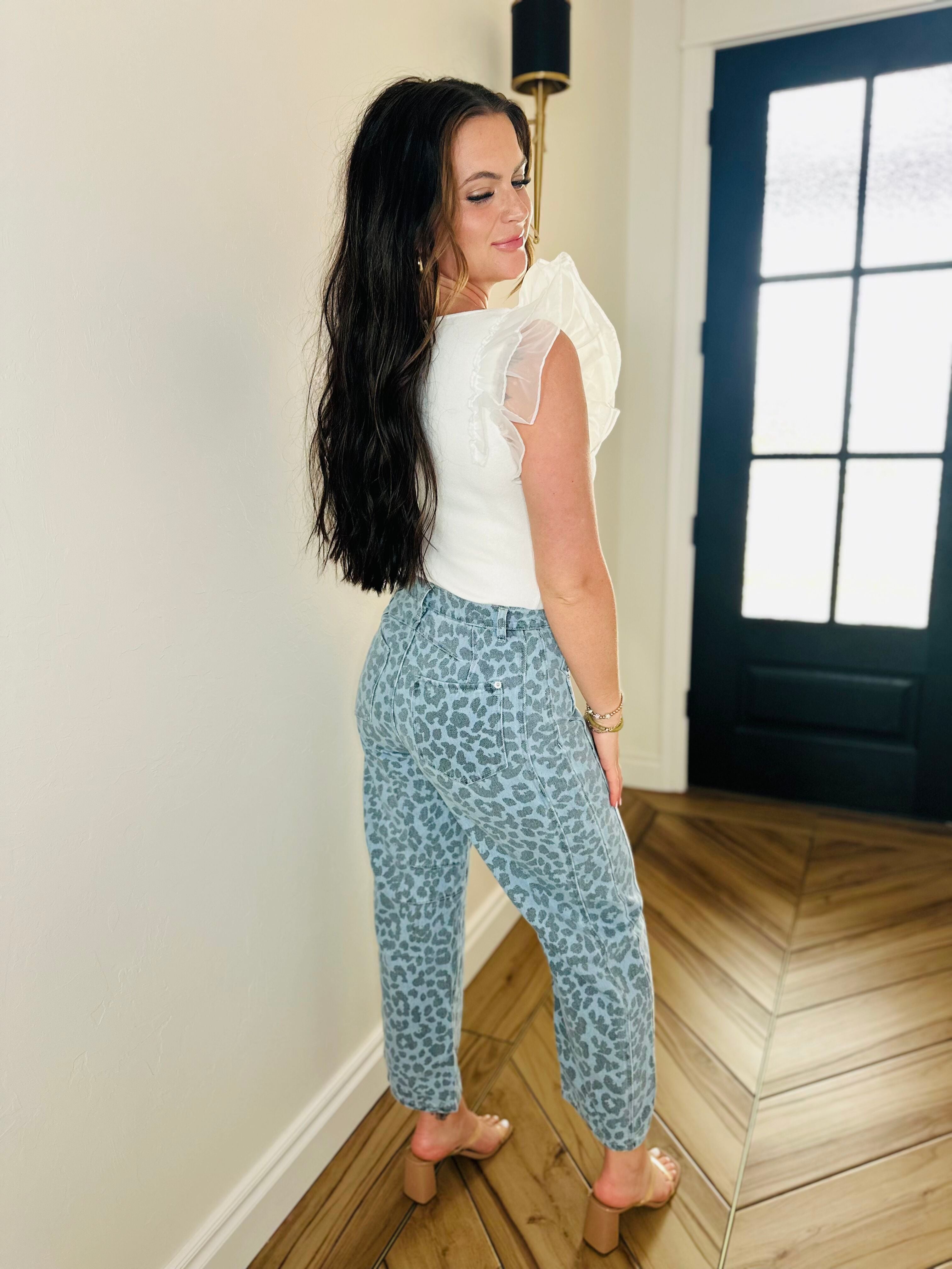 Stylish Blue Leopard Denim Jeans by Entro showcasing a unique leopard print design for a bold fashion statement.
