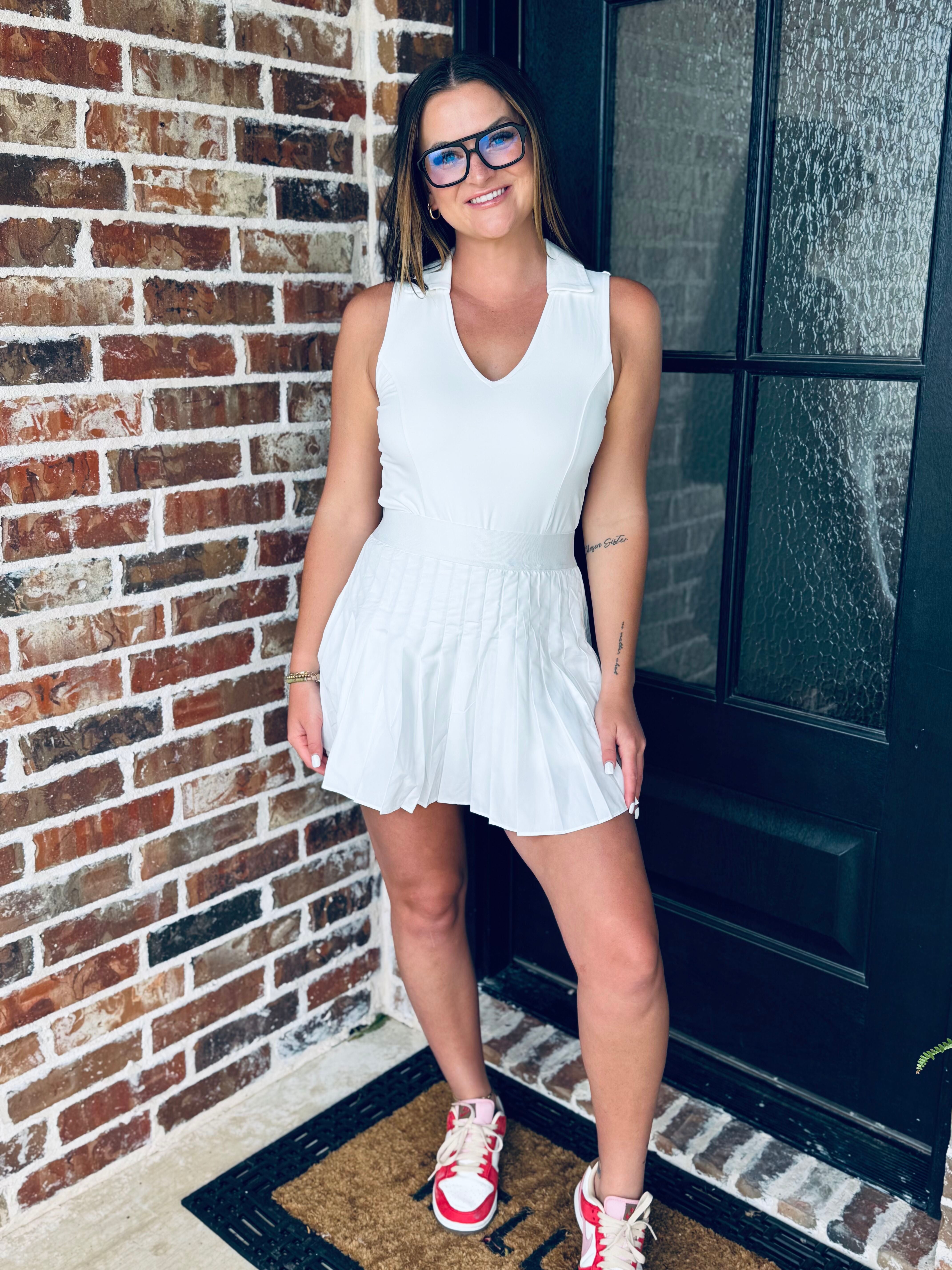 Close-up of the WHITE V-NECK COLLARED ATHLETIC DRESS emphasizing its classic collar design and flattering v-cut neckline, ideal for tennis or golf.