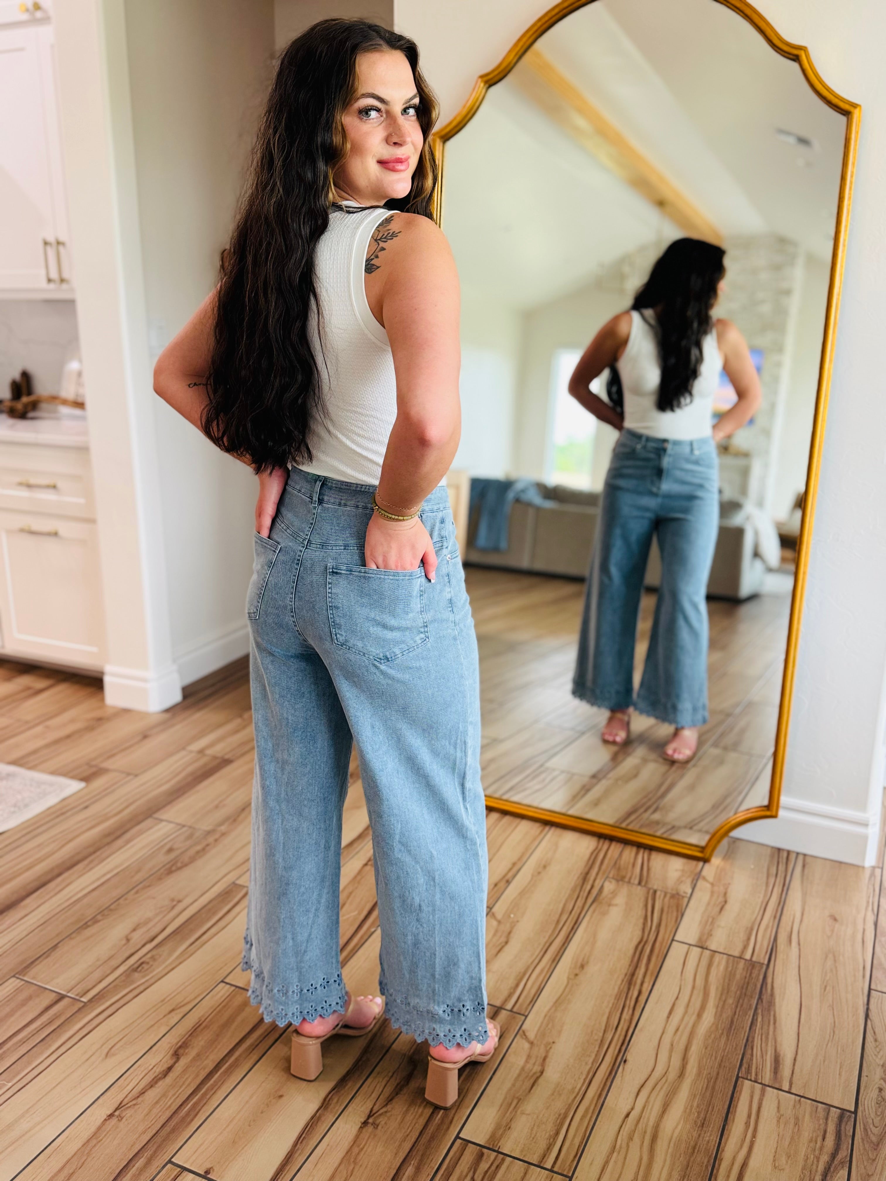 The Bluebell Scallop Denim Jeans – Light Wash by ENTRO showcased with a trendy outfit.