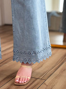 Close-up detail of the scalloped hem on the Bluebell Scallop Denim Jeans – Light Wash by ENTRO.