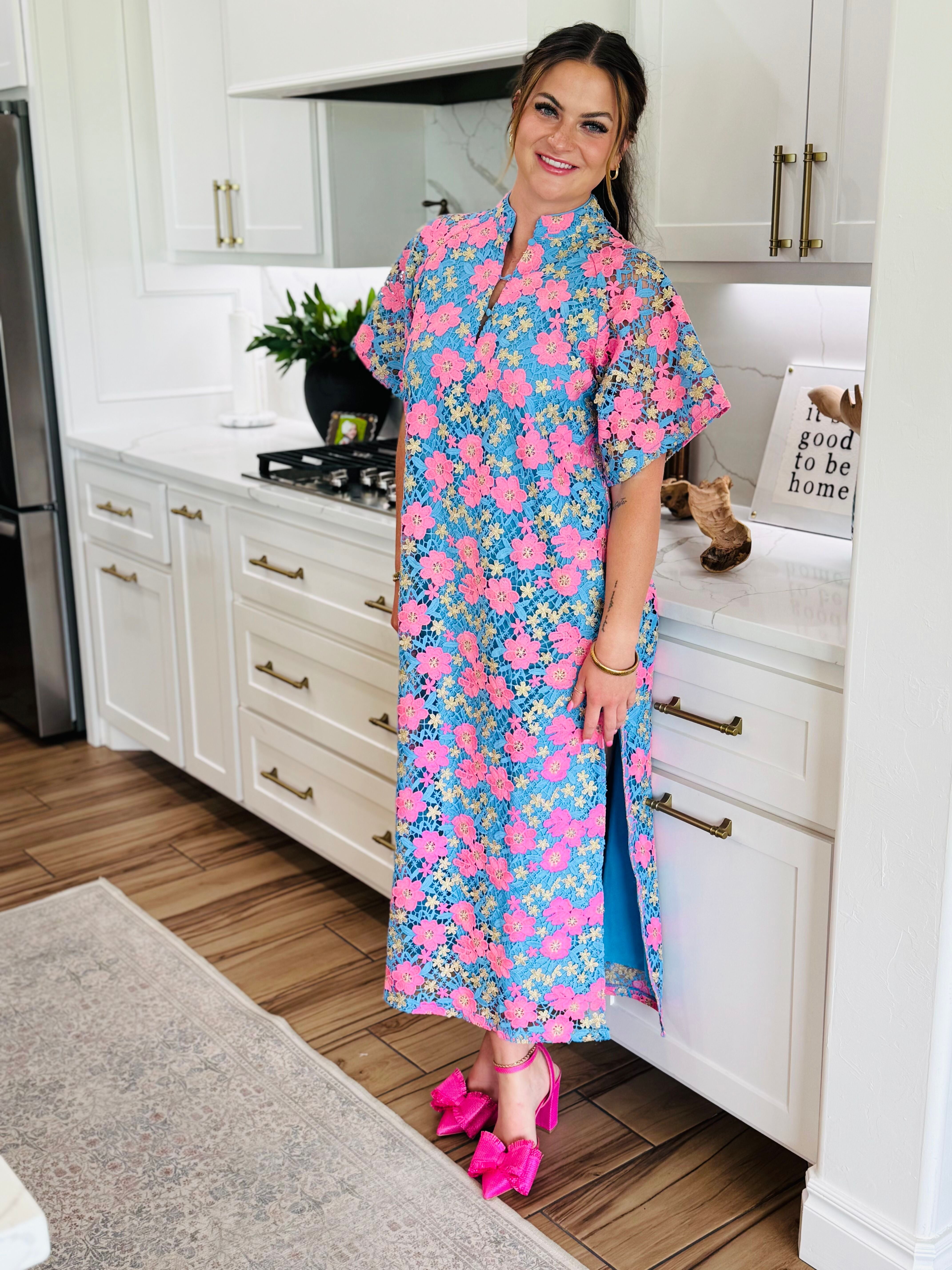 Full view of the LEIGHTON PANSY MAXI DRESS BY BUDDY LOVE styled for a special event, showcasing its relaxed fit and vibrant floral print.