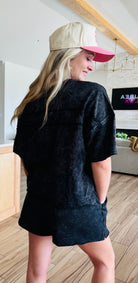Black Mineral Washed Short Set by Very J, featuring a comfy oversized short sleeve top with a patch pocket and stylish side slit shorts with drawstring, perfect for lounging or casual outings.