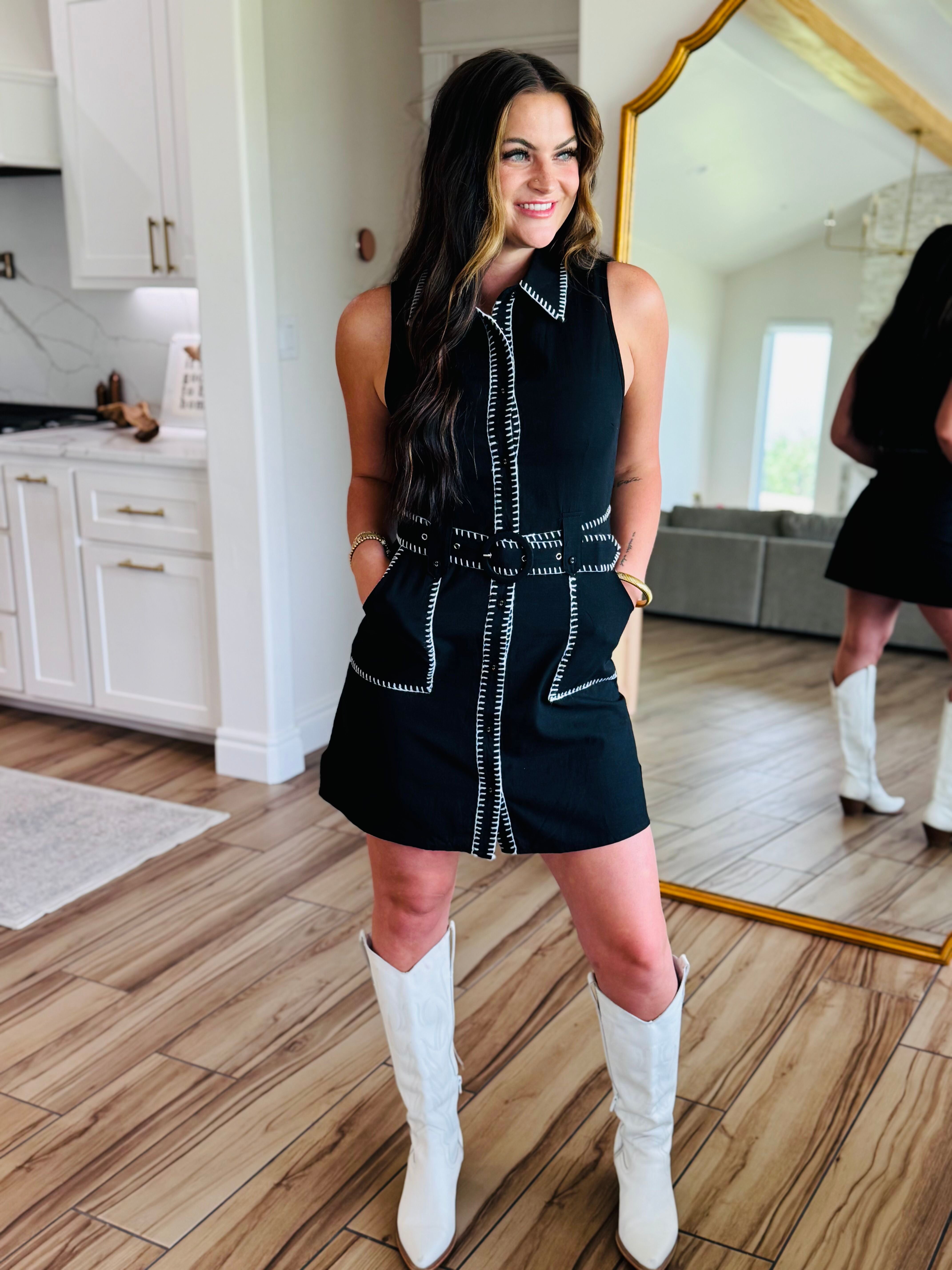 Full view of the Black Sleeveless Dress with Contrast Stitching showcased on a mannequin, highlighting its longer length and tailored silhouette for elevated everyday wear.