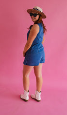 Denim Vest and Skort Set featuring elegant gold buttons, ideal for concerts and casual outings.