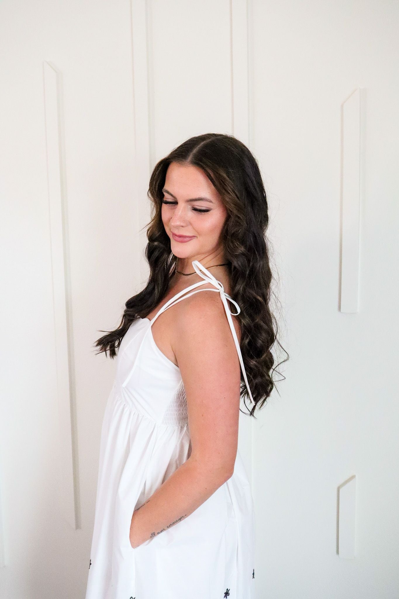 Close-up of the intricate black embroidery on the white and black embroidered maxi dress by Entro, highlighting its stylish details and comfort.