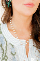 Elegant close-up of the Logan Pearl Necklace by Linny Co, showcasing the beautiful pearl pendant on a durable gold chain, ideal for layering with other jewelry or as a classy gift.