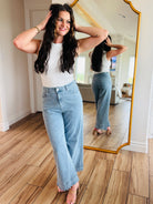 Full view of the Bluebell Scallop Denim Jeans by ENTRO, styled with a white tank top for a casual summer look.