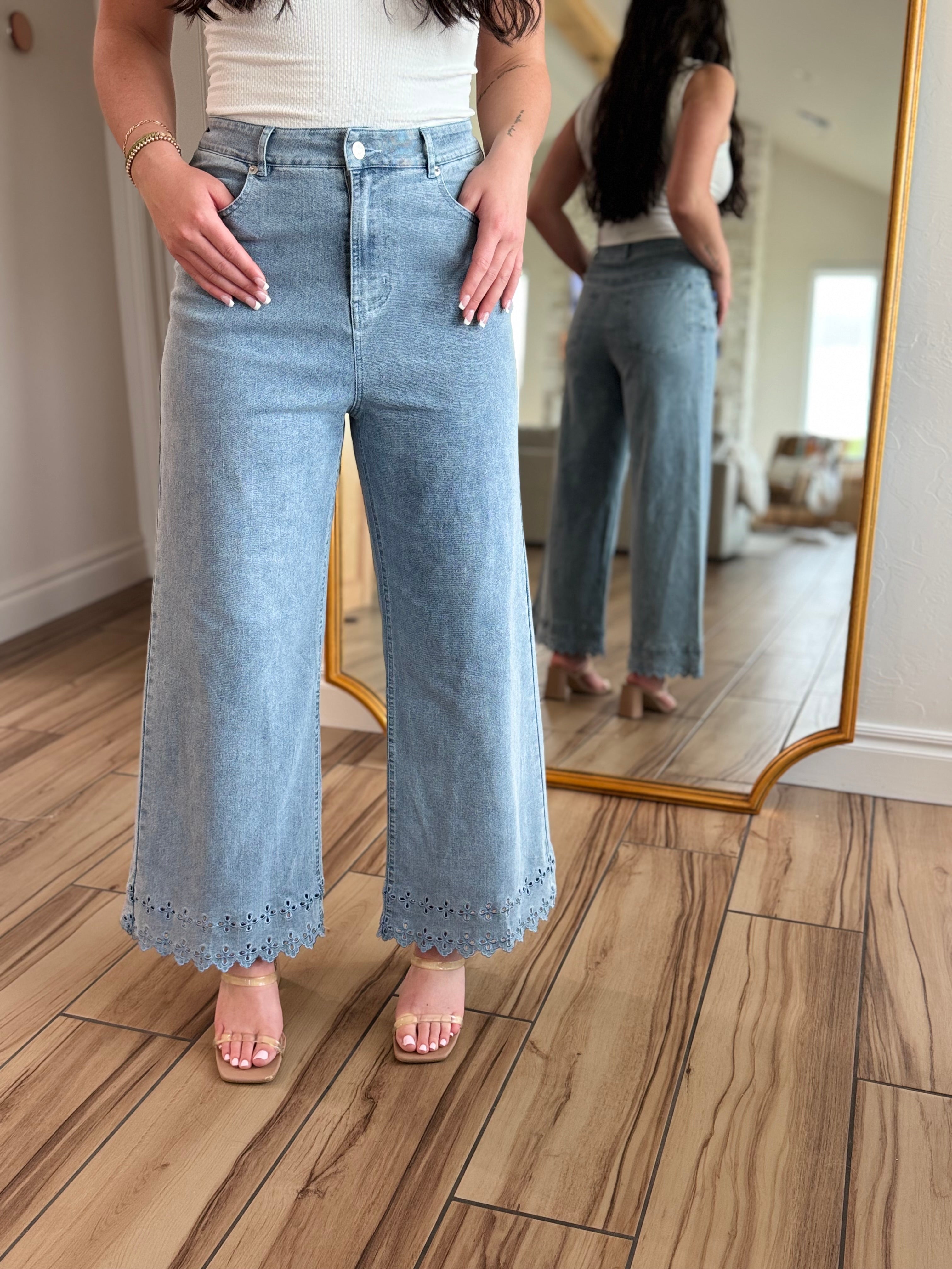 Model wearing Bluebell Scallop Denim Jeans by ENTRO, demonstrating their mid-rise fit and classic five-pocket design for everyday wear.