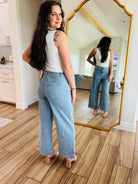 Fashionable side view of Bluebell Scallop Denim Jeans – Light Wash by ENTRO emphasizing the mid-rise fit.