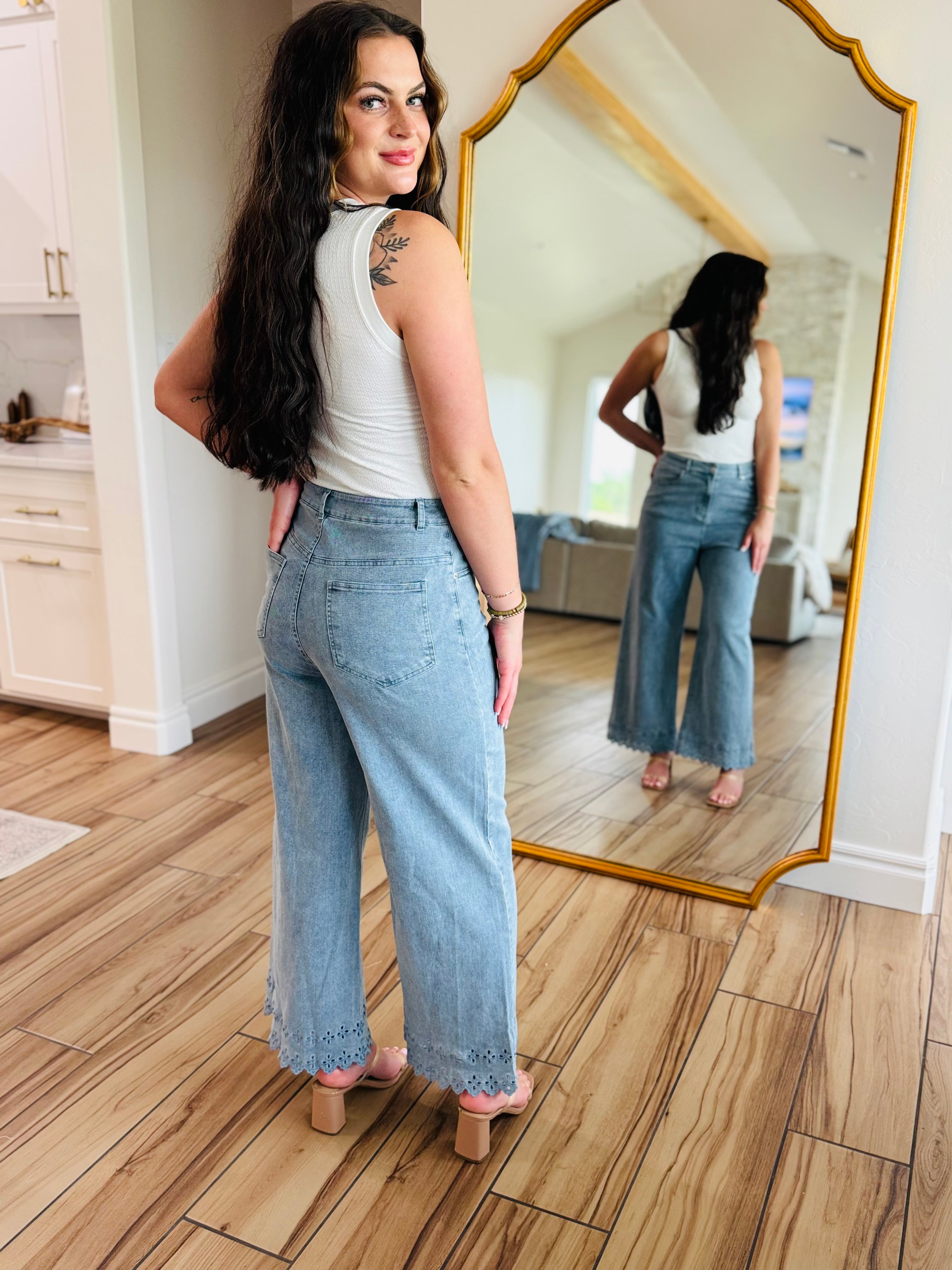 Fashionable side view of Bluebell Scallop Denim Jeans – Light Wash by ENTRO emphasizing the mid-rise fit.