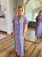 Close-up view of the Leighton Pansy Maxi Dress by Buddy Love highlighting the intricate floral design and stylish knee slits.