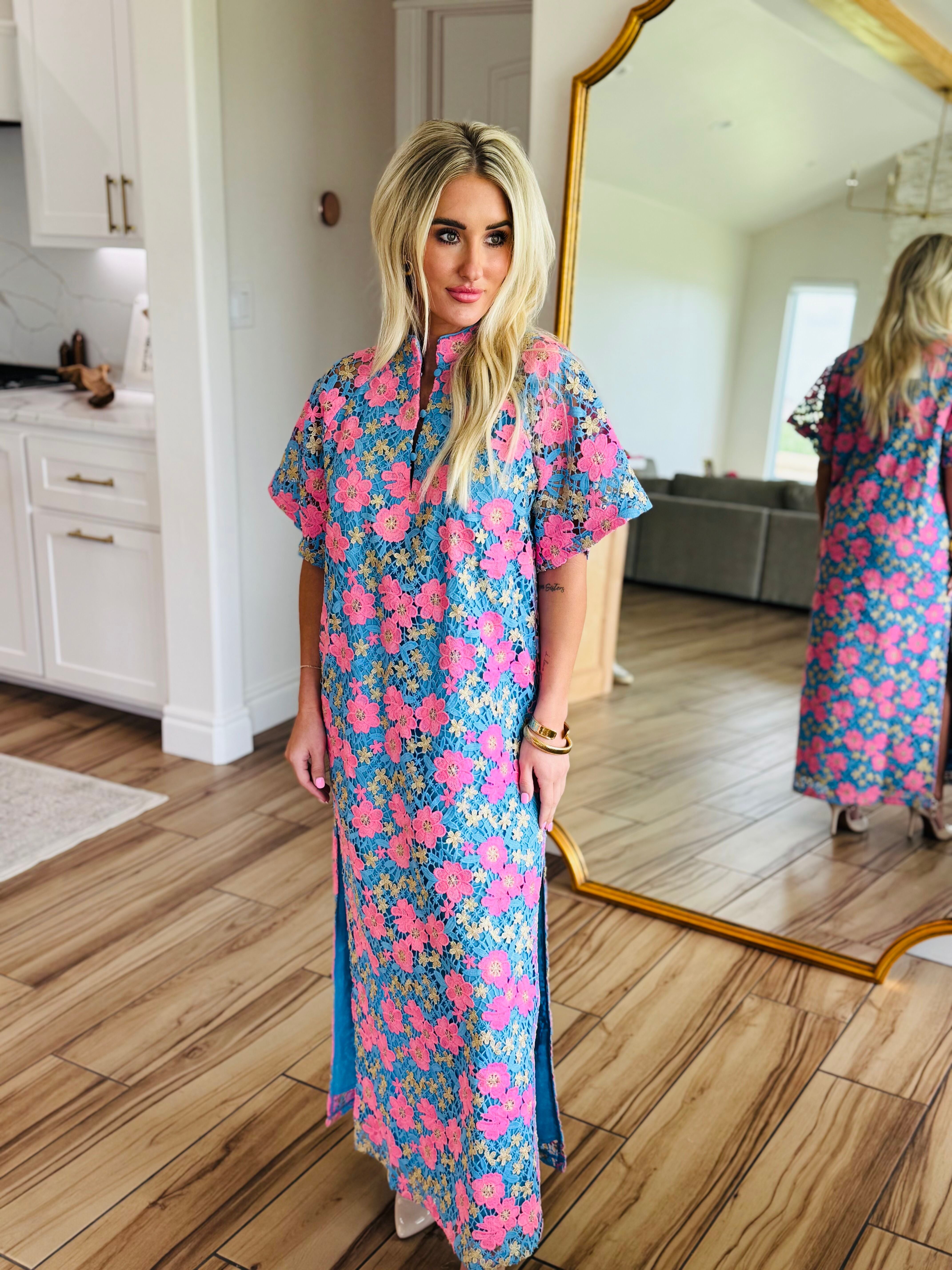 Close-up view of the Leighton Pansy Maxi Dress by Buddy Love highlighting the intricate floral design and stylish knee slits.