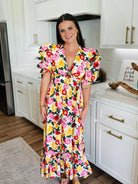 Close-up of the small keyhole cutout on the chest of the Miranda Puff Sleeve Maxi Dress by Buddy Love.