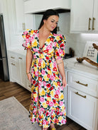 The back view of Miranda Puff Sleeve Maxi Dress by Buddy Love showcasing the smocked backing for a comfortable fit.