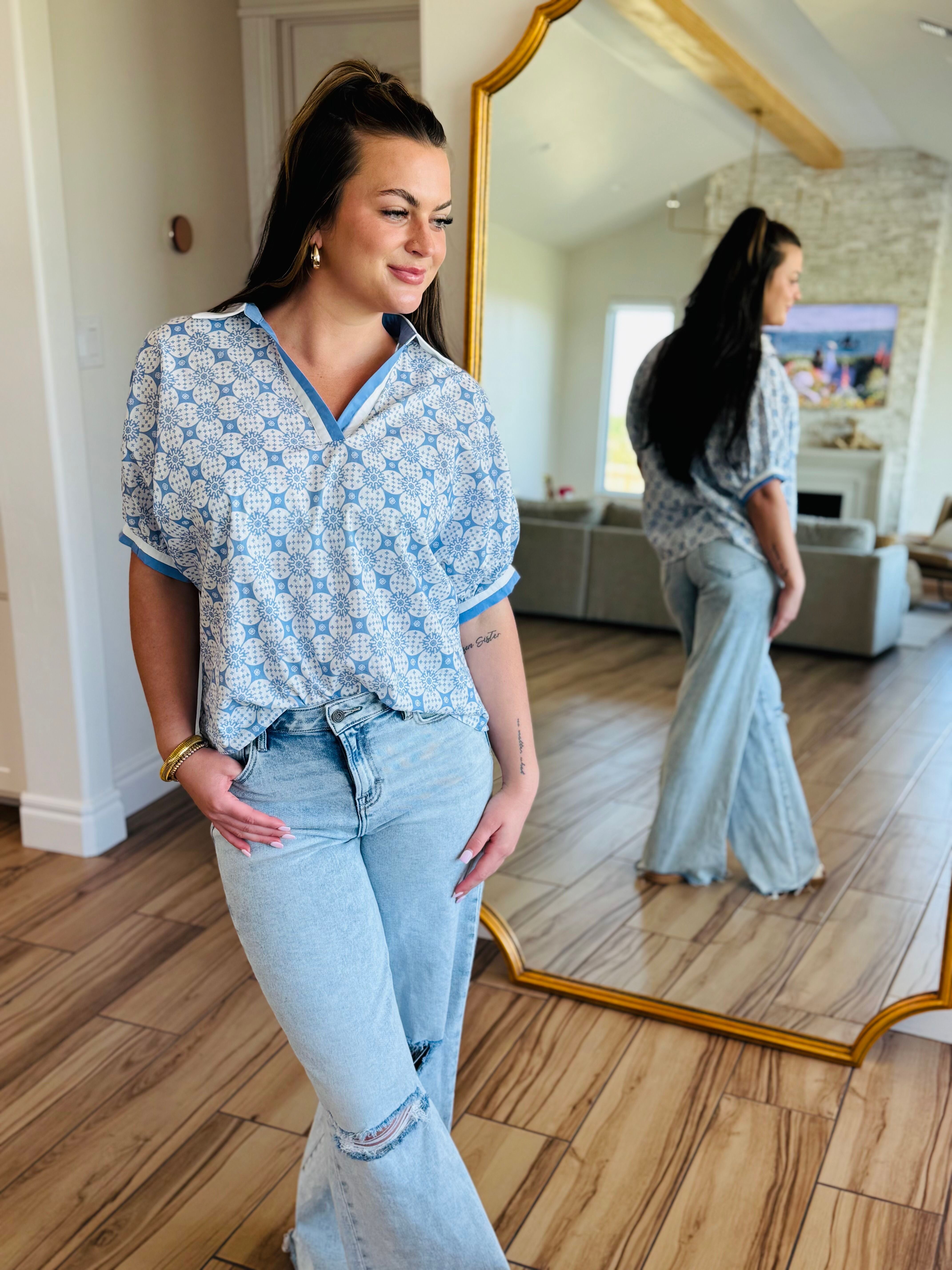 ENTRO Chambray Top featuring a flattering neckline design, perfect for summer styling.