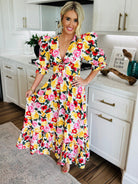 Close-up view of the smocked back of the Miranda Puff Sleeve Maxi Dress by Buddy Love, featuring a keyhole cutout.