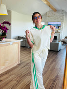 Casual look with the ENTRO CREAM PANT SET, styled effortlessly for any occasion, demonstrating versatility and comfort.