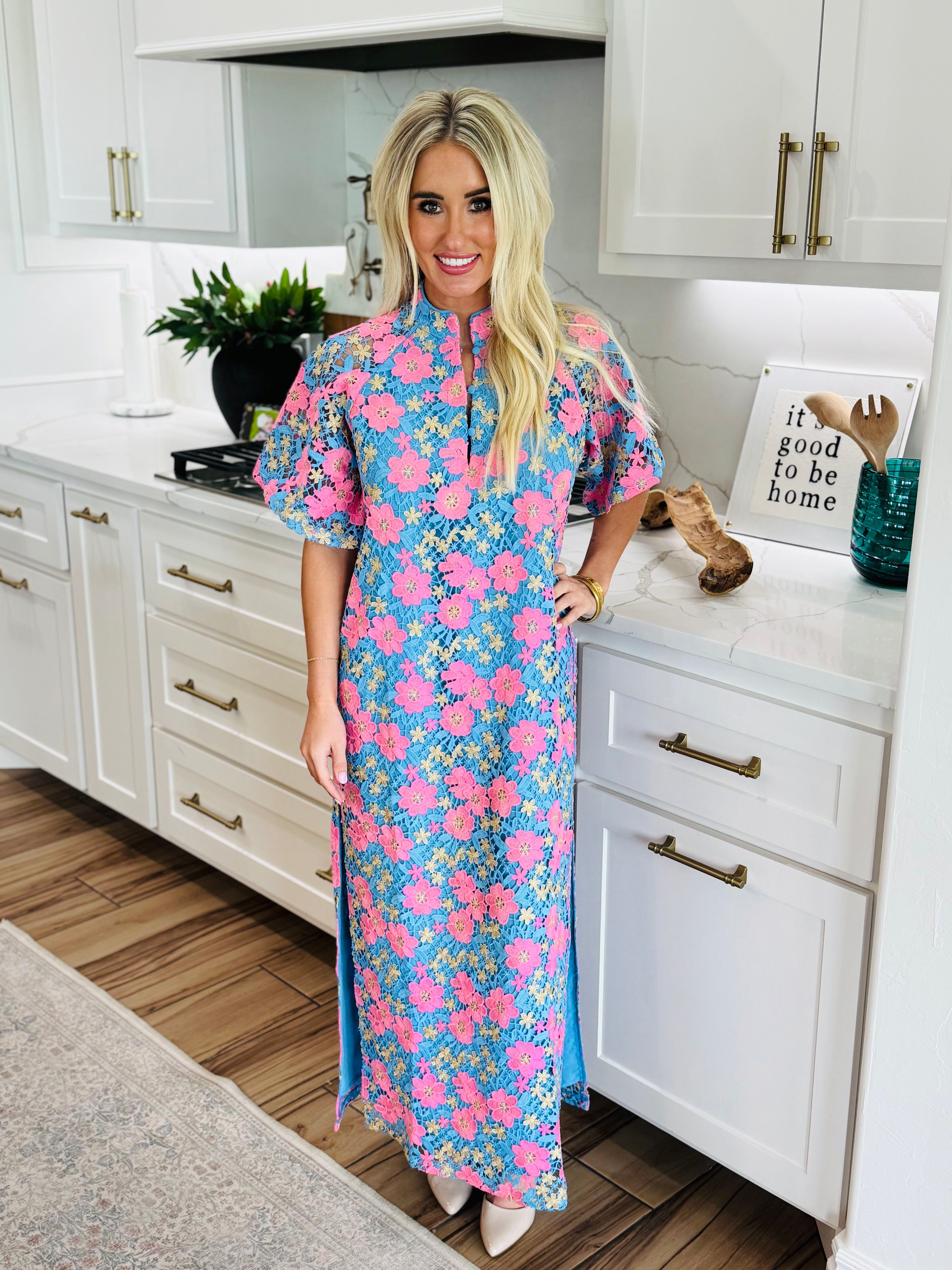 Side view of the Leighton Pansy Maxi Dress by Buddy Love, featuring a flowy design and two slits for a fashionable touch.