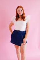 Entro Dark Denim Skort showcasing its stylish design and comfortable elastic waist for a chic and versatile addition to your wardrobe.