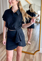 Stylish black linen two piece skirt set designed by Mable, showcasing a fitted skirt and loose-fit top, perfect for versatile styling.