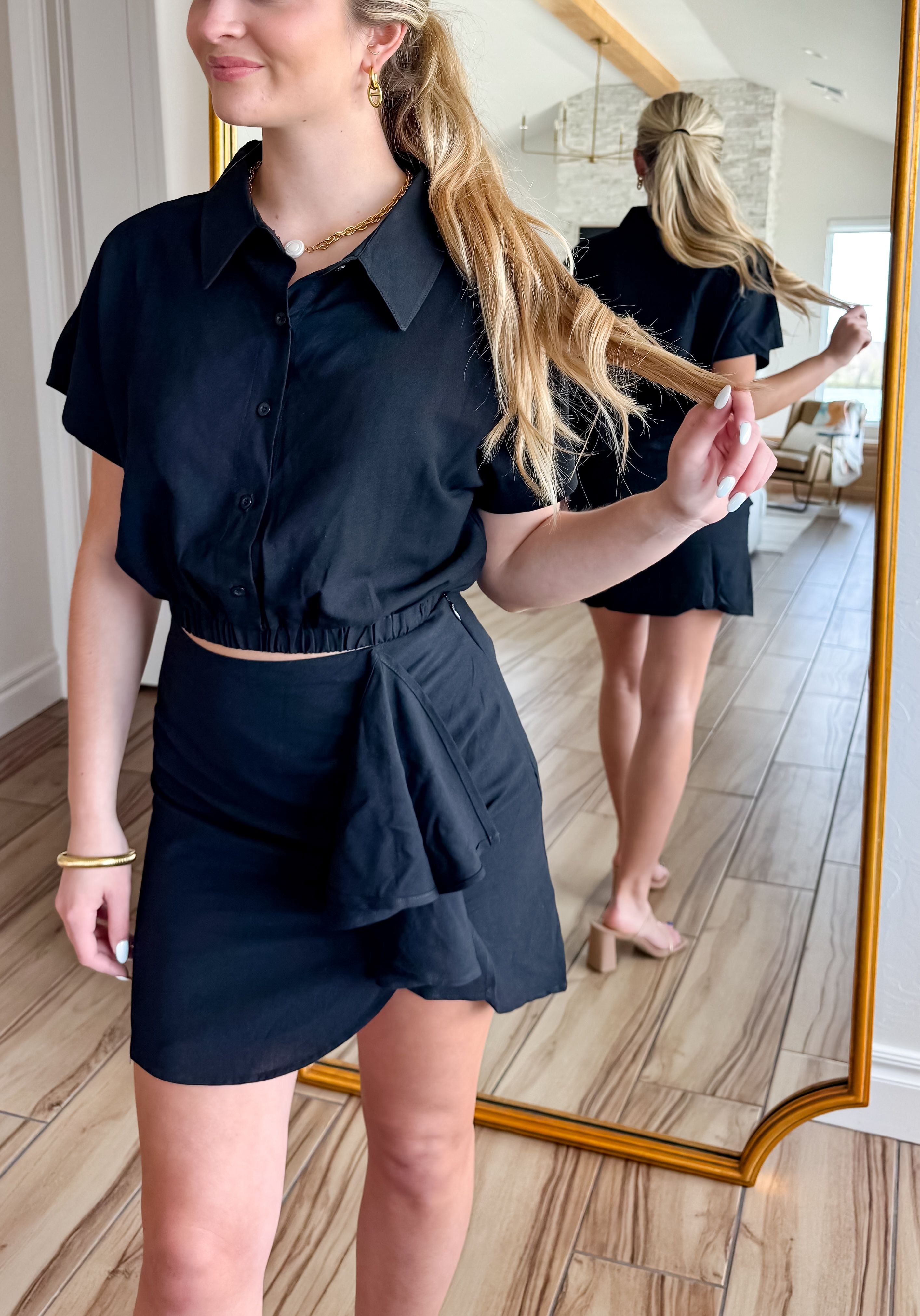 Stylish black linen two piece skirt set designed by Mable, showcasing a fitted skirt and loose-fit top, perfect for versatile styling.