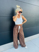 BROWN SOLID HIGH WAIST DRAWSTRING WIDE LEG PANTS BY ENTRO - Bottoms