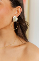 Stylish Iridescent Flower Top Hoops in White, perfect for adding a touch of elegance to any outfit. These lightweight and dainty earrings are ideal for both upscale and casual dressing.