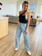 Model wearing Blue Leopard Denim Jeans in a casual setting, highlighting the trendy and eye-catching leopard print.