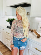 FLIRTY FLORALS SHEER TOP