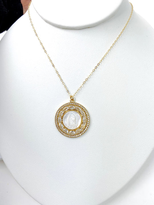Close-up of the PEARL MOTHER OF MARY NECKLACE showcasing the intricate rhinestone details surrounding the pearl circle, a must-have accessory for a touch of sparkle.