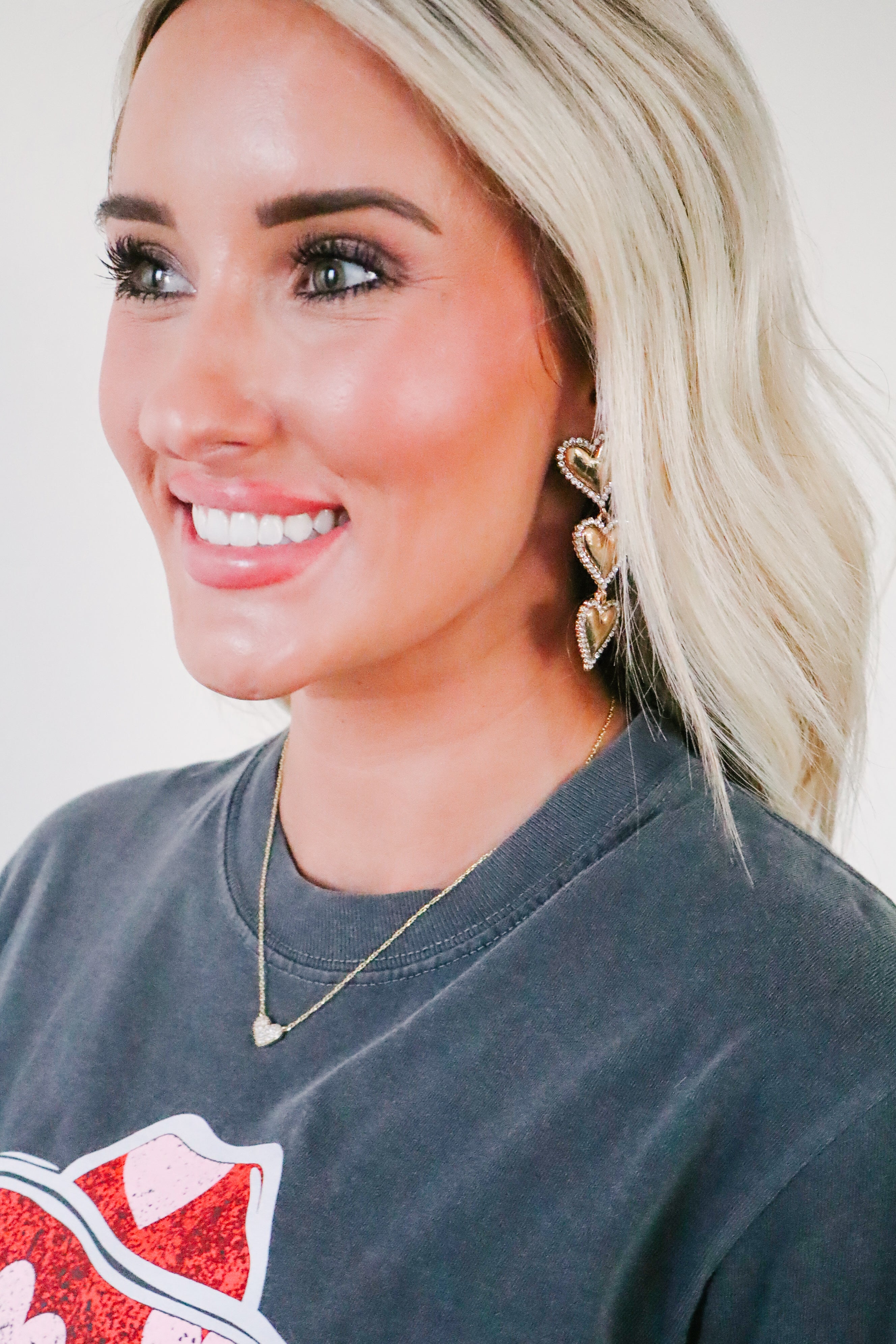 Layla - Gold Heart Earrings displayed on a velvet background, accentuating their beauty and craftsmanship perfect for sensitive skin.