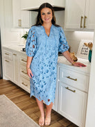 Pamela Poppy Maxi Dress by Buddy Love styled with sandals, ideal for romantic dinners and chic outings.