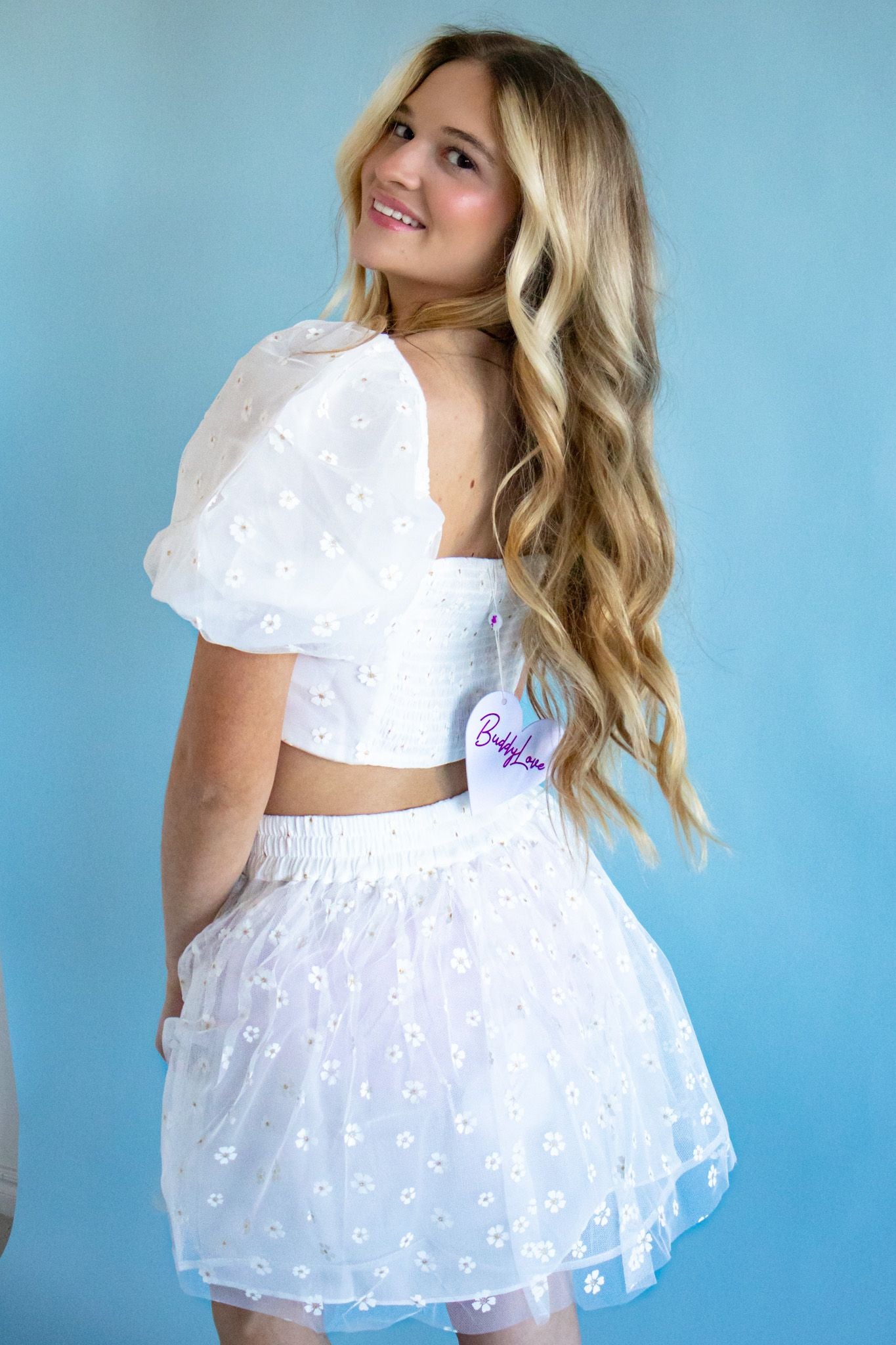 Close-up of the Cutie English Daisy White Floral Top and Skirt Set featuring pleats and smocked details, ideal for spring styling.