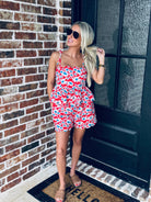 Model wearing the Red, White and Blue Floral Matching Short Set with sunglasses and sneakers, perfect for casual summer celebrations.